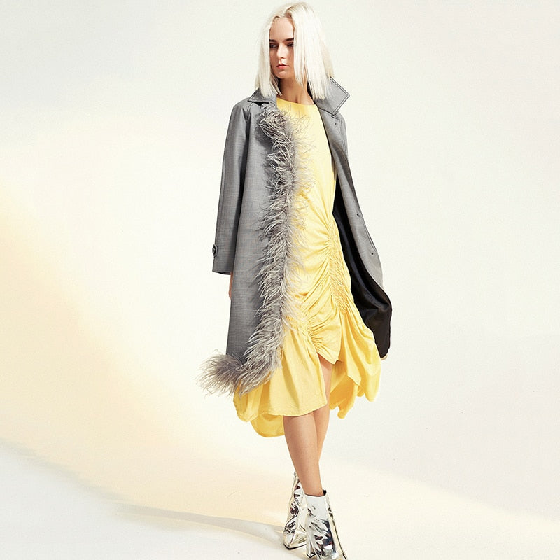 Asymmetric feathered trench