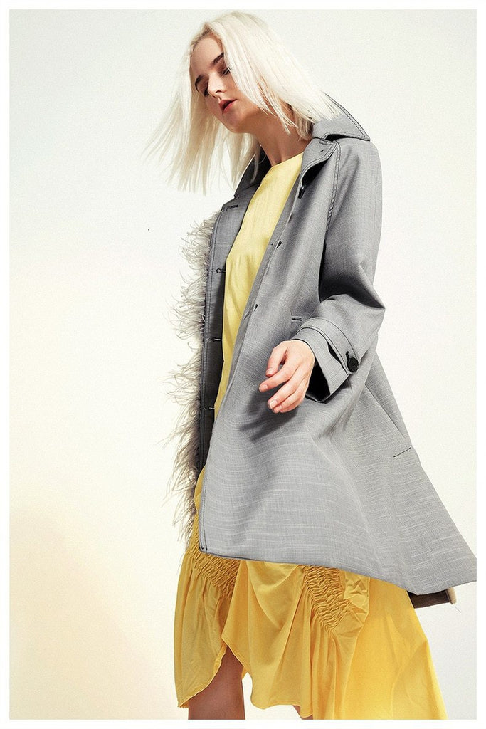 Asymmetric feathered trench
