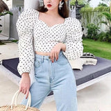 Polka dot puff sleeve top in white