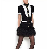 Black and white mini dress decorated with feathers