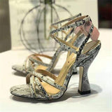 Serpent print cross-tied sandals