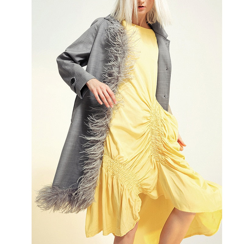 Asymmetric feathered trench