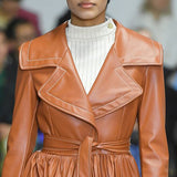 Pleated belted faux leather coat
