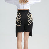 Extravagant high-waist laced up pants