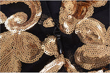 Black'n'gold long-sleeved mini dress with sequined patchwork