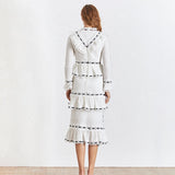 GABO ruffled midi dress in white